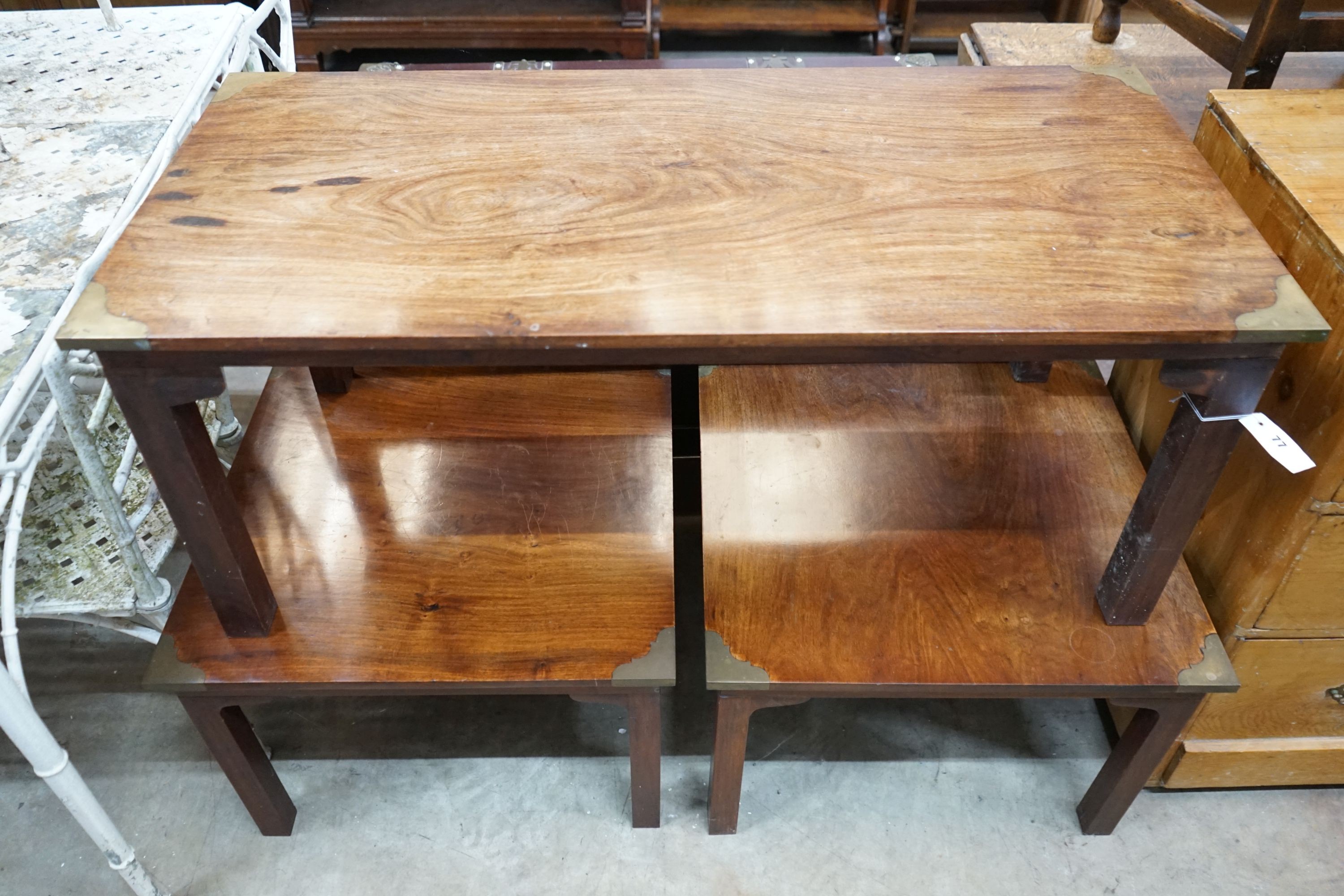 A set of three Indian hardwood brass mounted coffee tables, largest 112cm, depth 53cm, height 46cm